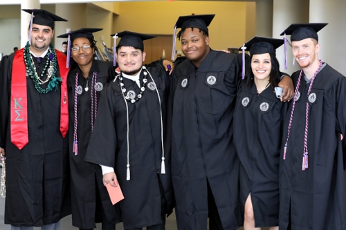 MGA grads in regalia at a commencement ceremony.